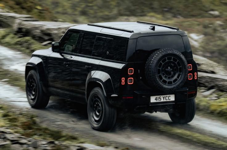 defender octa black edition rear three quarter moving defender octa black edition in motion
