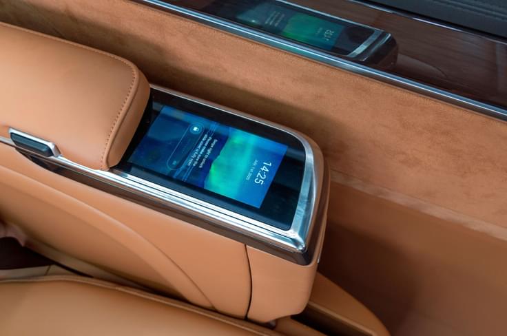 Armrest-mounted screen controls seat, cooling and lighting functions. MG M9 second row touchscreen control