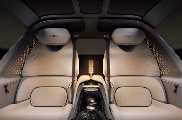 The rotary dial on the center console can be used to control various vehicle functions. Bentley EXP 15 rear seats