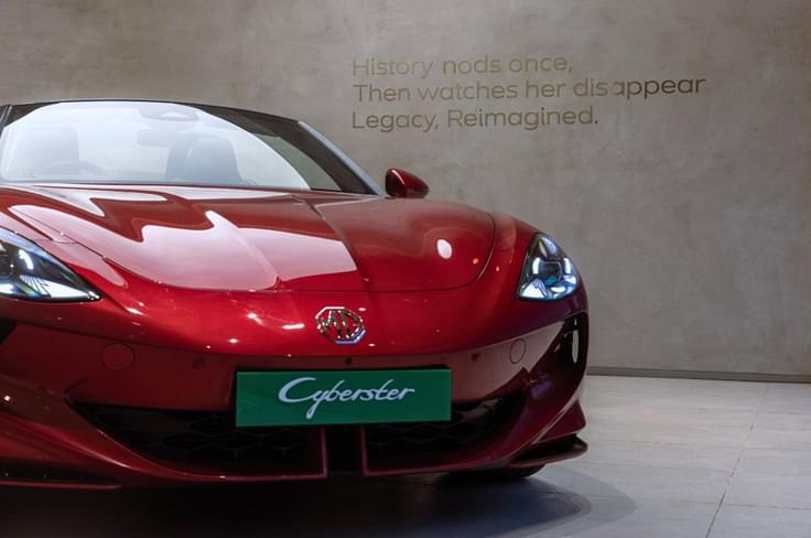 Red front shot of the MG cyberster in a MG select showroom Red front shot of the MG cyberster in a MG select showroom