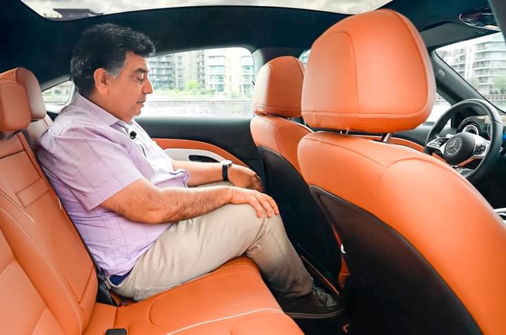 Rear seat comfort is compromised due to a knees-up seating position and upright backrest. Mercedes-Benz CLA EV rear seat space