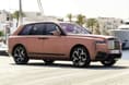 rolls royce cullinan black badge in field front three quarter rolls royce cullinan black badge in field