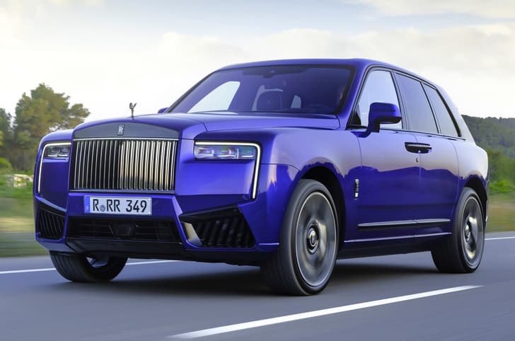 rolls royce cullinan black badge on road
