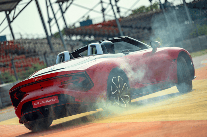 MG Cyberster electric roadster drifting with tyre smoke on race track