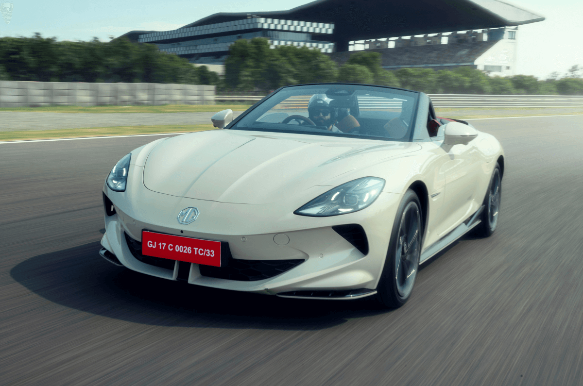 MG Cyberster electric sportscar in white taking on race track corner