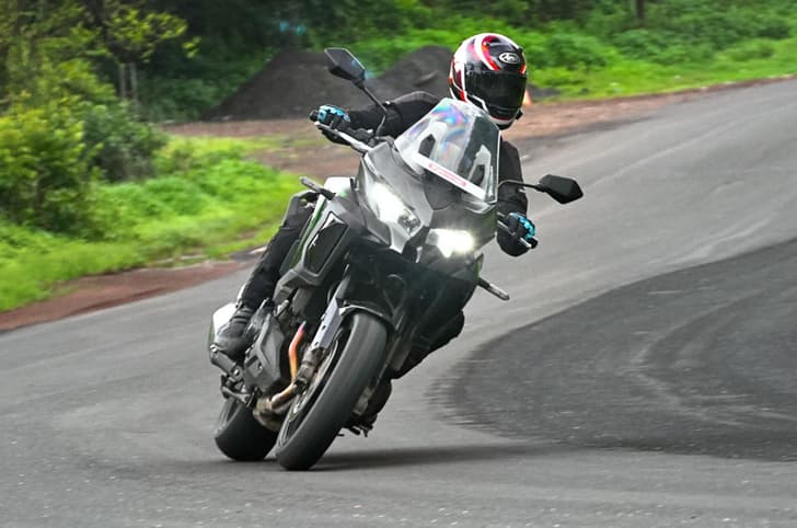Kawasaki Versys 1100 cornering shot in field