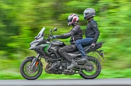 Kawasaki Versys 1100 ridden with two people left side profile shot