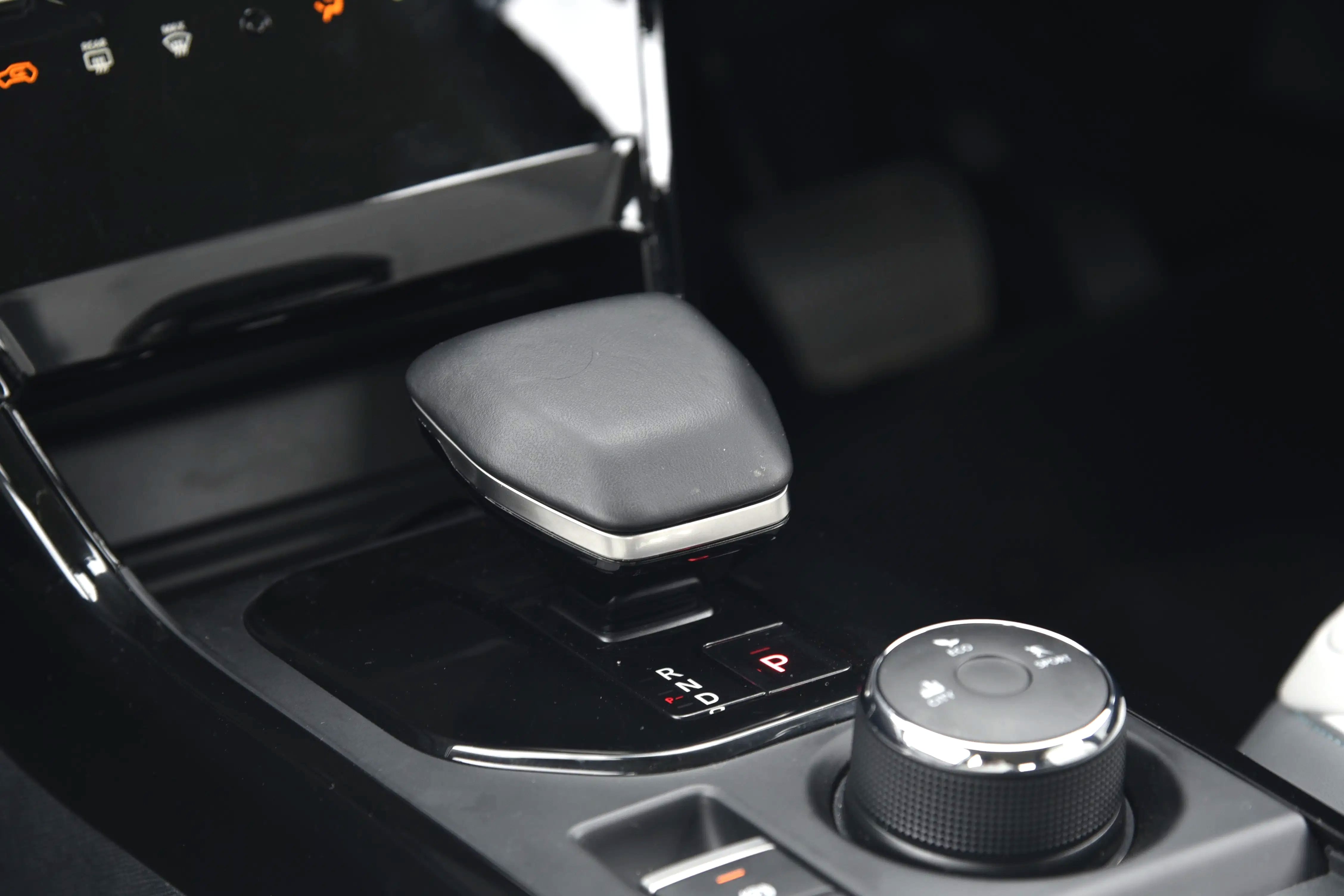 Aircraft-style gear selector looks premium but can be slow to respond at times.