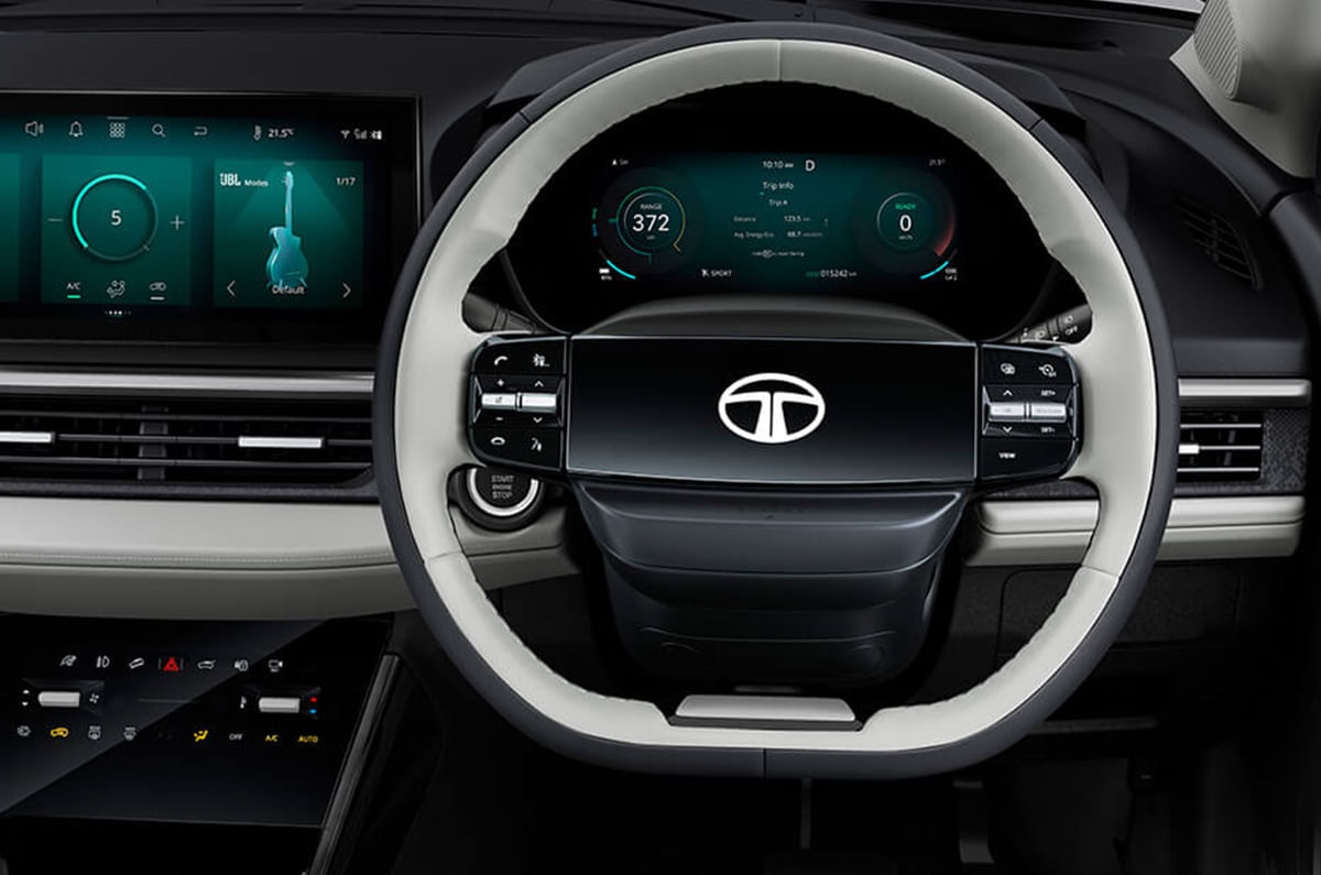 Steering wheel features an illuminated Tata logo.