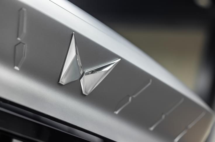 Mahindra Vision X twin Peaks logo and grille Mahindra Vision X twin Peaks logo