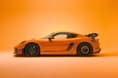 Porsche 718 Cayman GT4 RS with Manthey kit side profile in a studio Porsche 718 Cayman GT4 RS with Manthey kit side shot