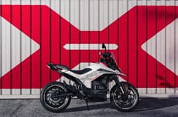 Ultraviolette X47 against white shipping container with large red X