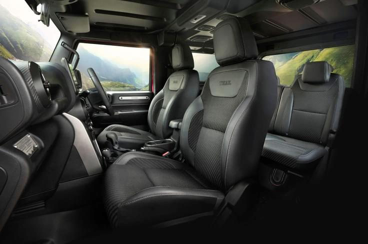 The 3 door Thar comes with black leather seats (fabric in the middle); access to the rear bench is still difficult. Mahindra Thar seats