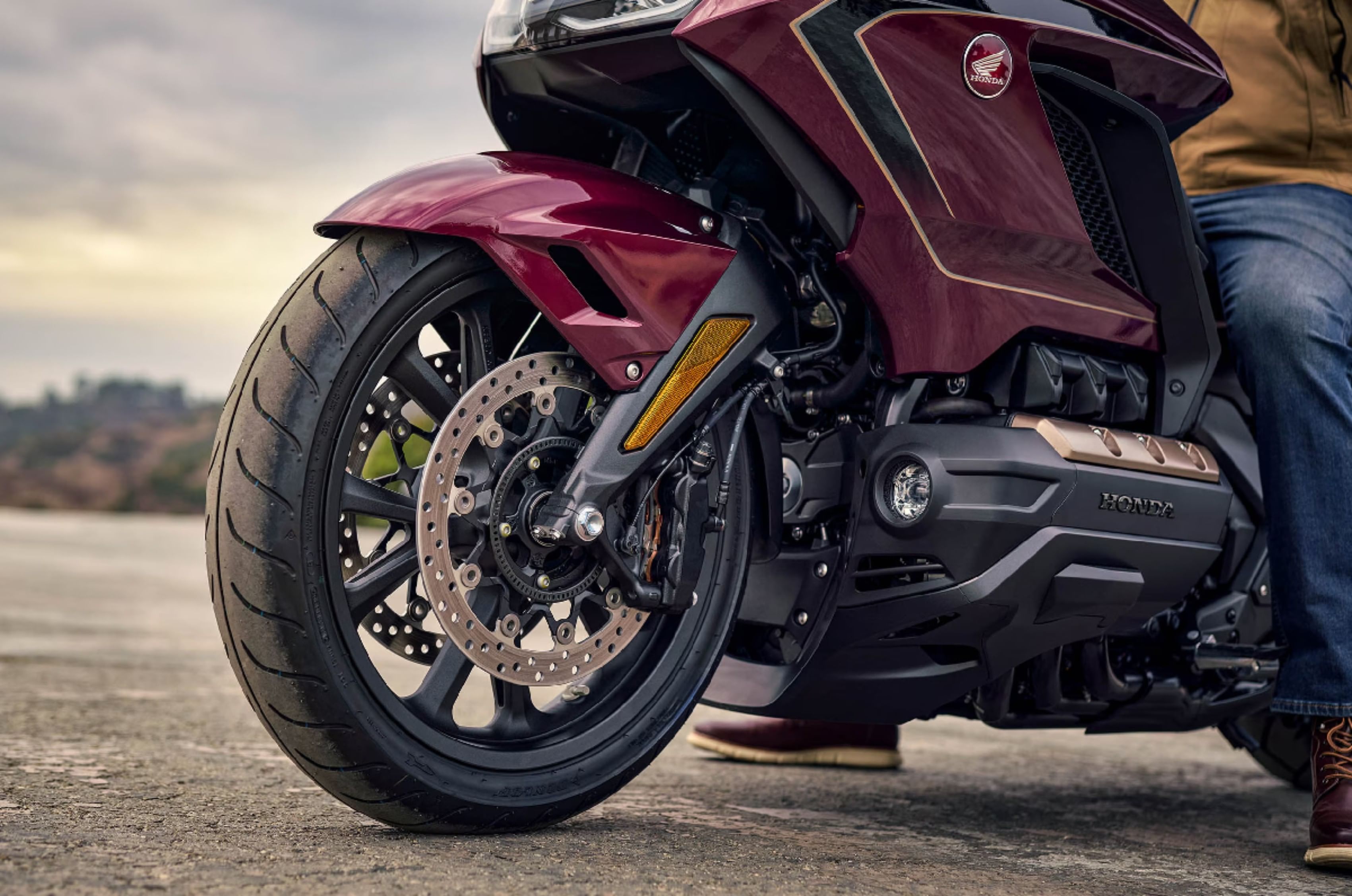 Suspension is handled by a double-wishbone setup at the front. 