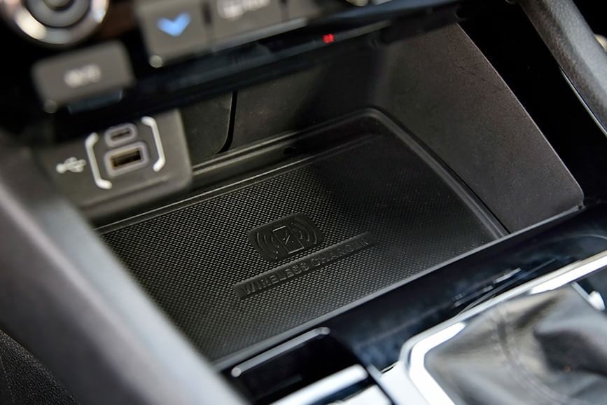 Charging needs are taken care of via USB ports and a wireless charging pad.