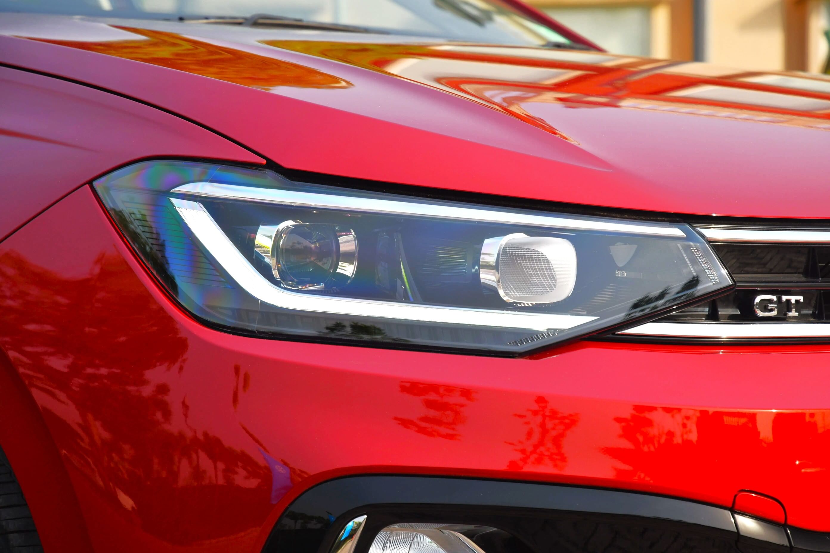 Sleek headlights have L-shaped LED DRLs that merge cleanly with the chrome lining in the grille.