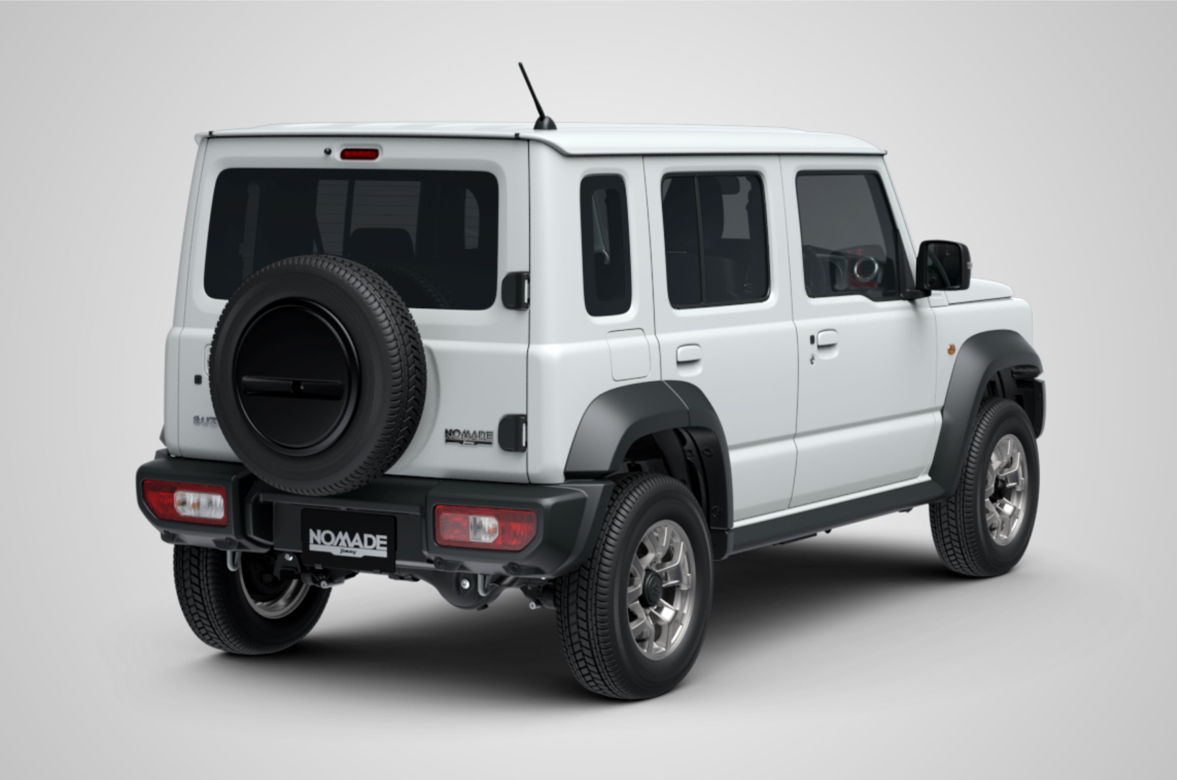 The rear is marked by a tailgate-mounted spare tyre and horizontally oriented lights positioned low down on the bumper.
