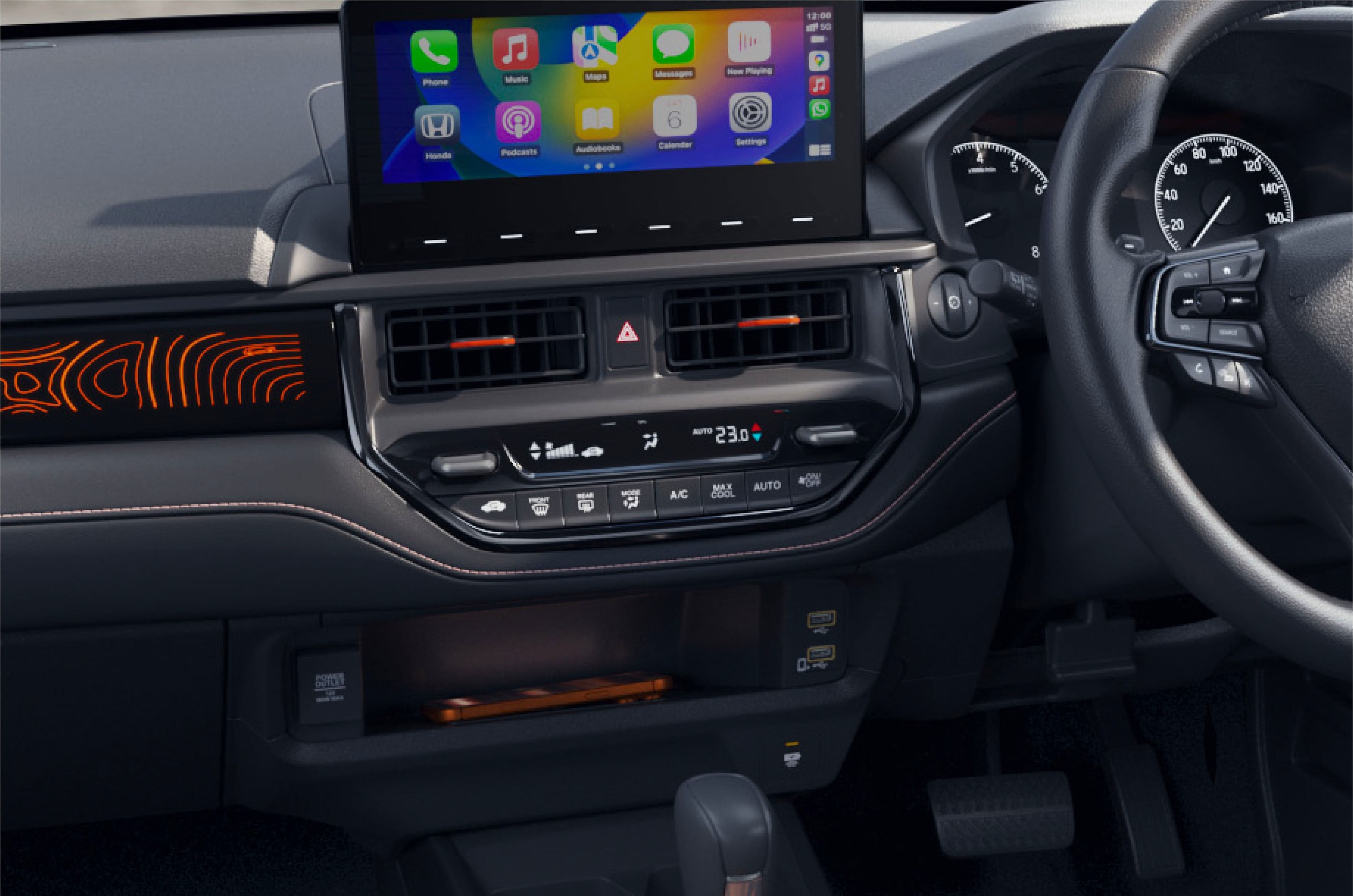 On the inside, it gets a black cabin with orange highlights and ADV terrain-inspired pattern on the panel