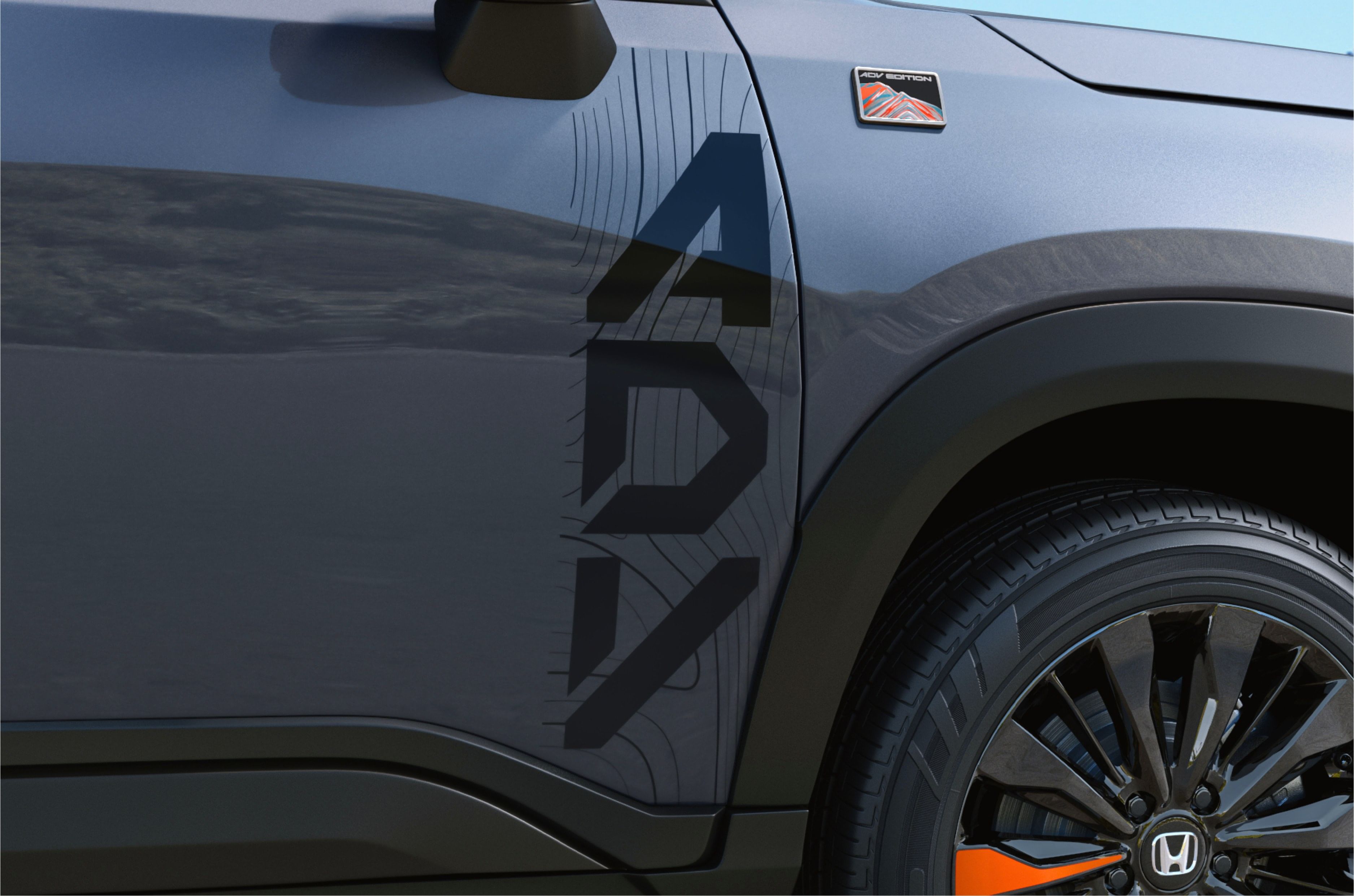 It features an ADV decal on the front doors