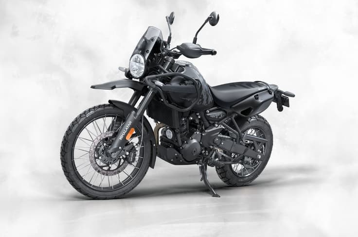 Essentially, this variant gets the tall, single-piece rally seat and the different tail section Royal Enfield Himalayan 450 Mana Black left front three quarter