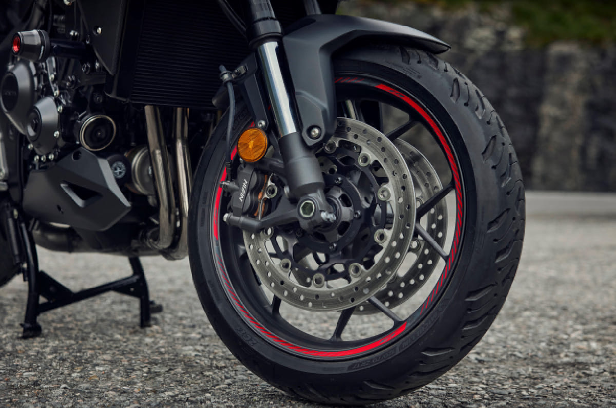 The front gets dual 310mm front discs with Nissin four-piston radial calipers.