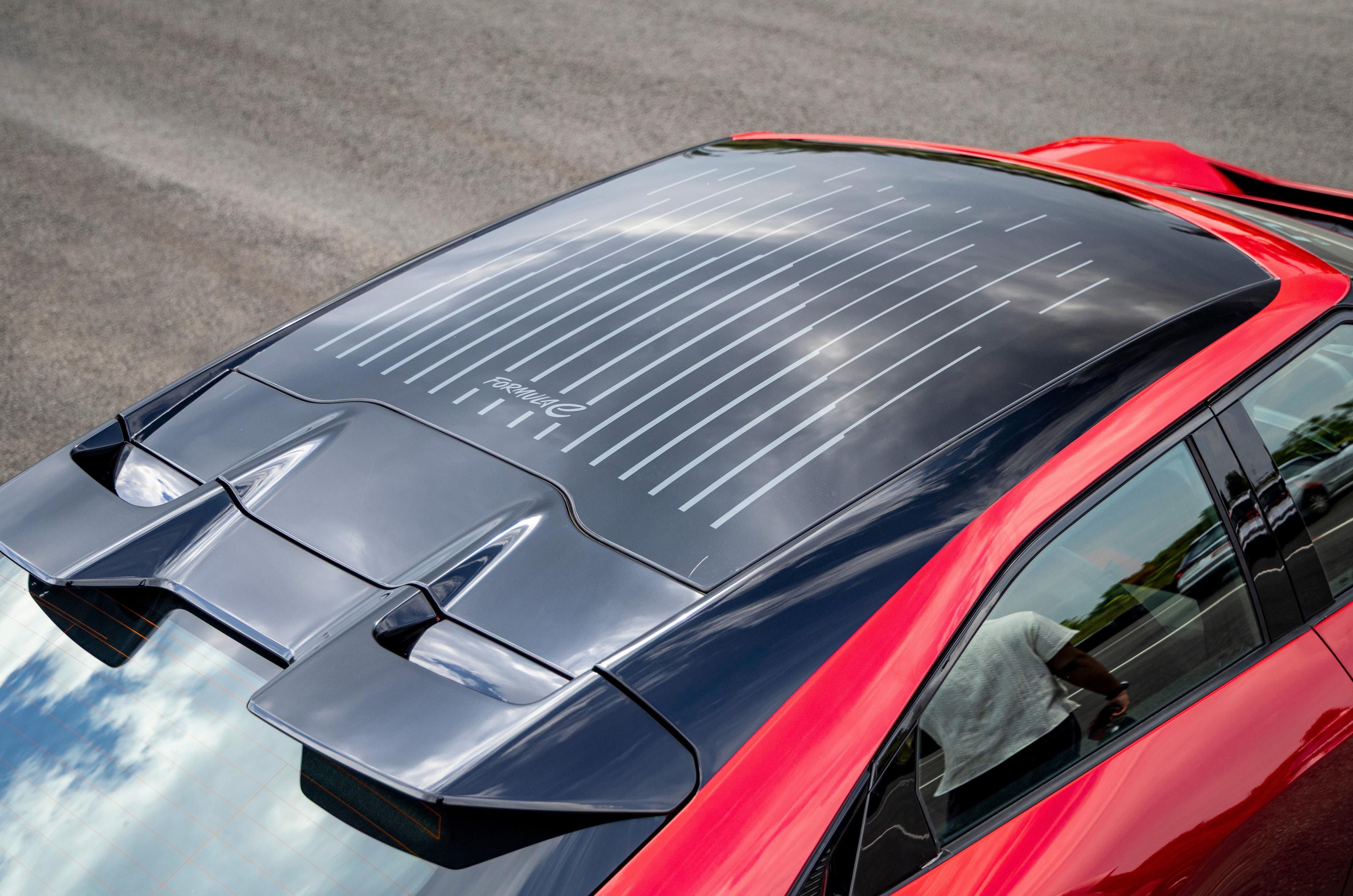 12-stripe graphics are also present on the panoramic glass roof.