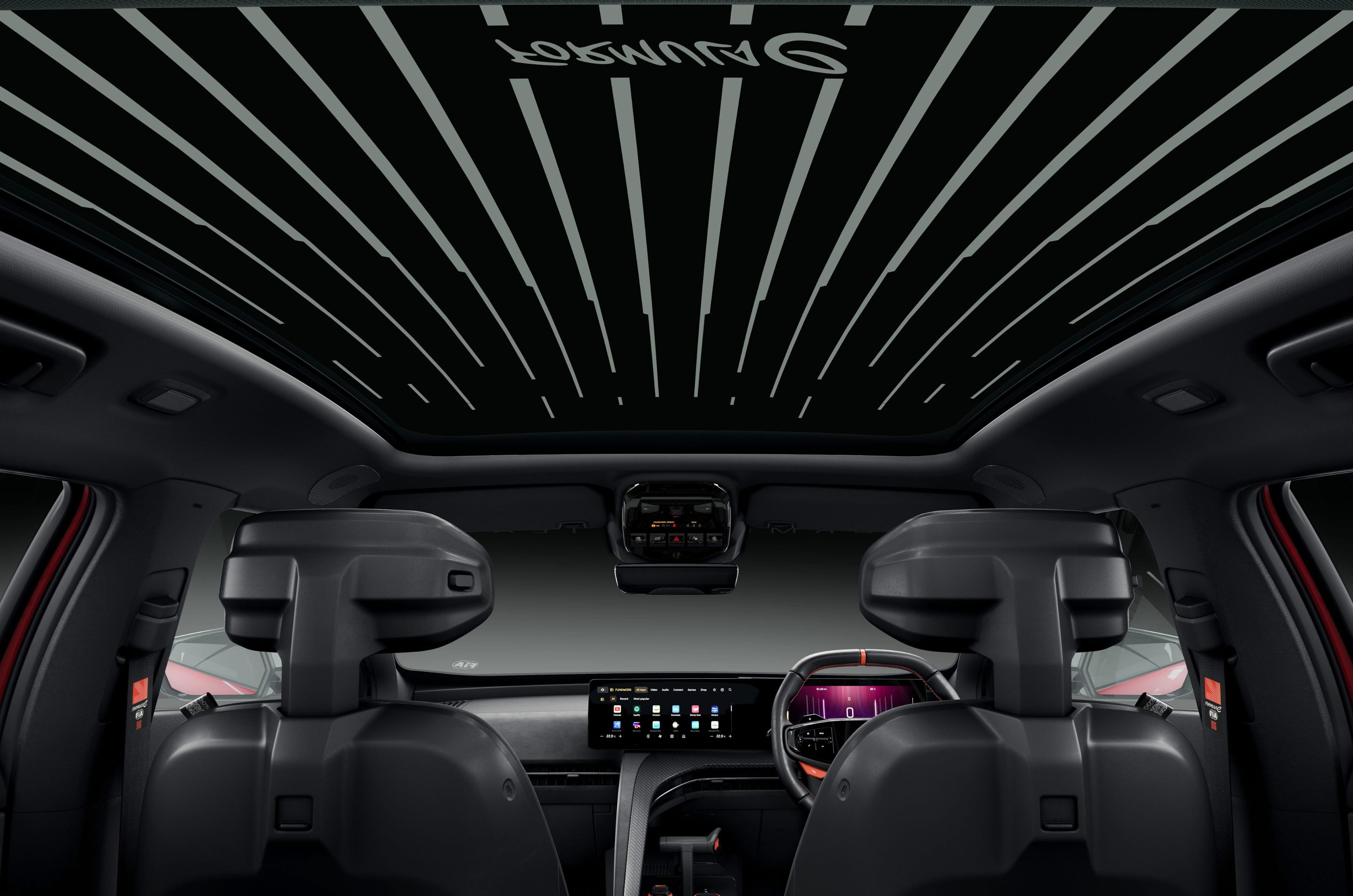 The glass roof also sports a 12-stripe graphic, representing the 12 years that the team has competed in the EV racing championship.