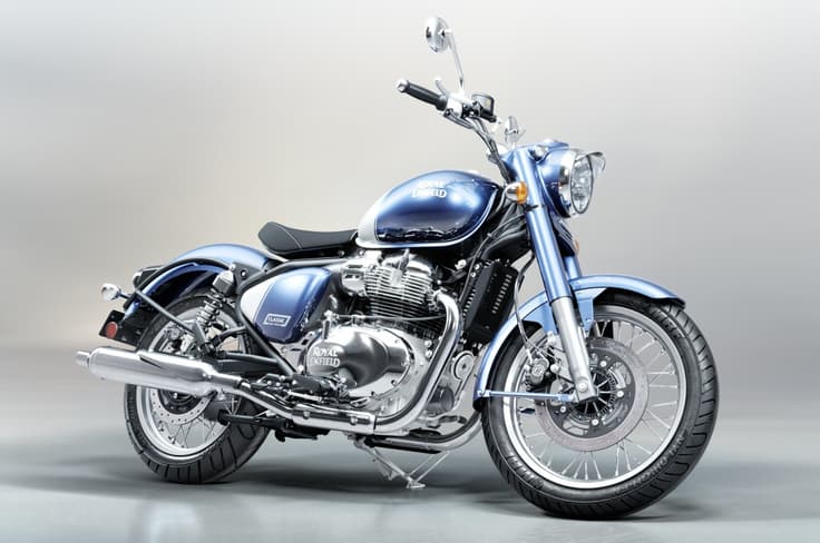 Just like the smaller 350cc Classic, it runs on 19/18-in wire-spoke rims. Royal Enfield Classic 650 blue colour front right static in studio