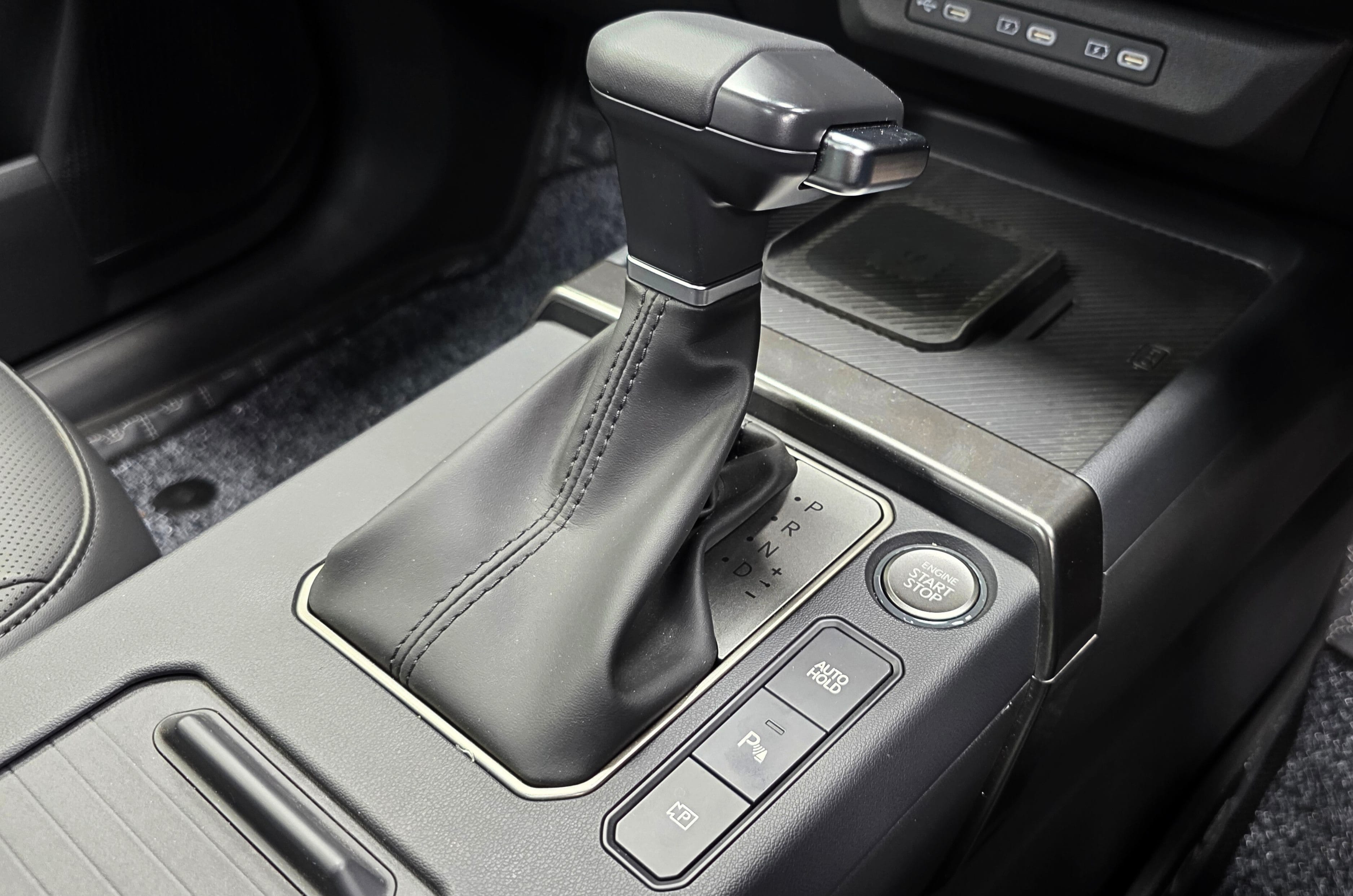 Push button start and 360-degree camera controls near the gear lever. 