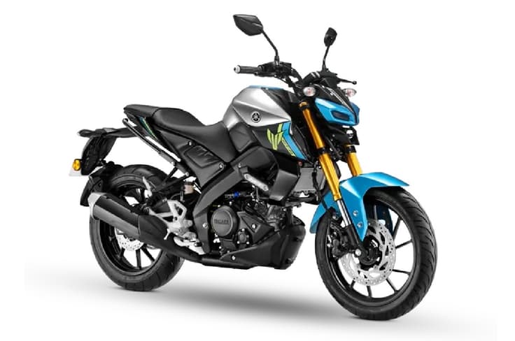 The standard variant comes with a LCD display while the DLX uses a colour TFT dash. Yamaha MT15 metallic silver cyan colour front right side static in studio