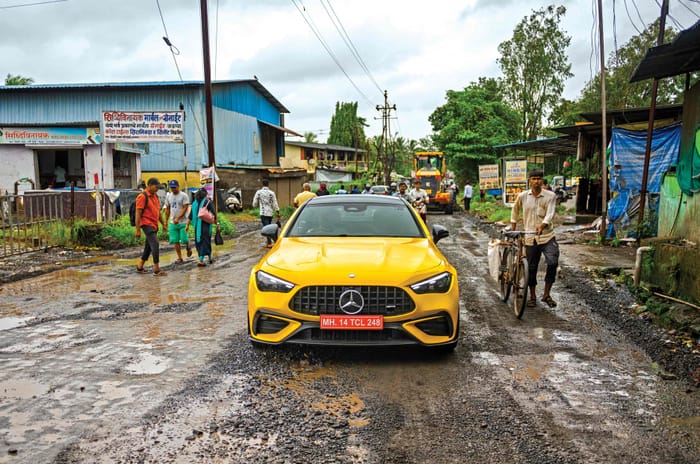 cle 53 coupe on a rough patch of road