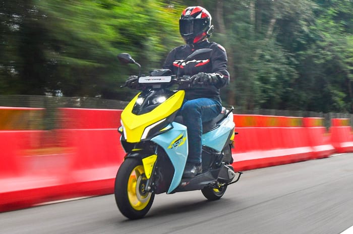 TVS Ntorq 150 front left side riding shot on track