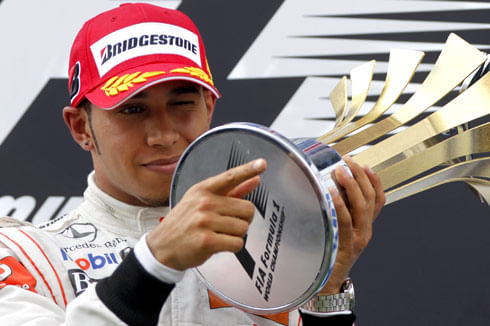 Lewis takes first win